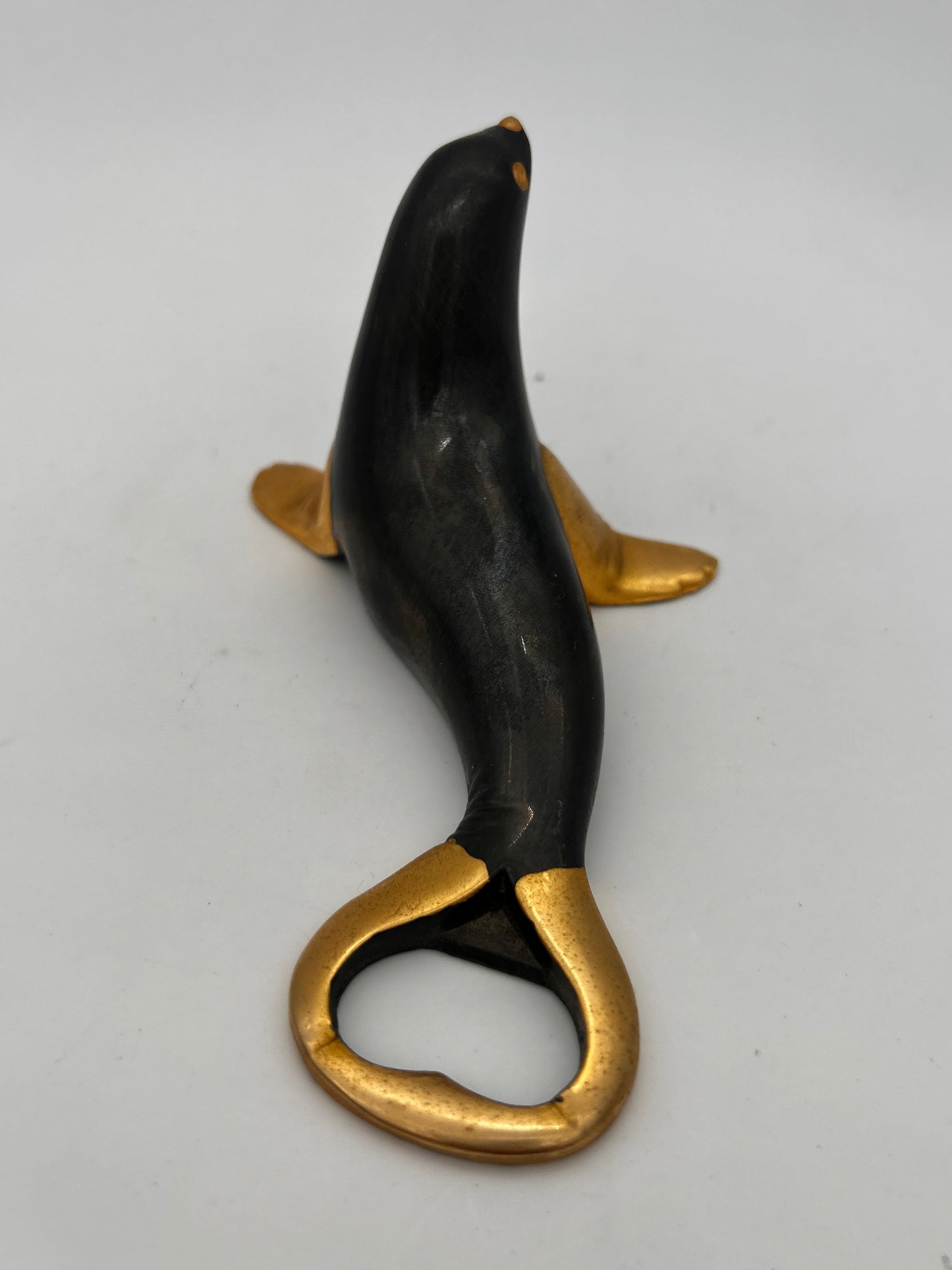 Décapsuleur otarie noir et or